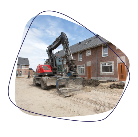 Foto van graafmachine met huizen
